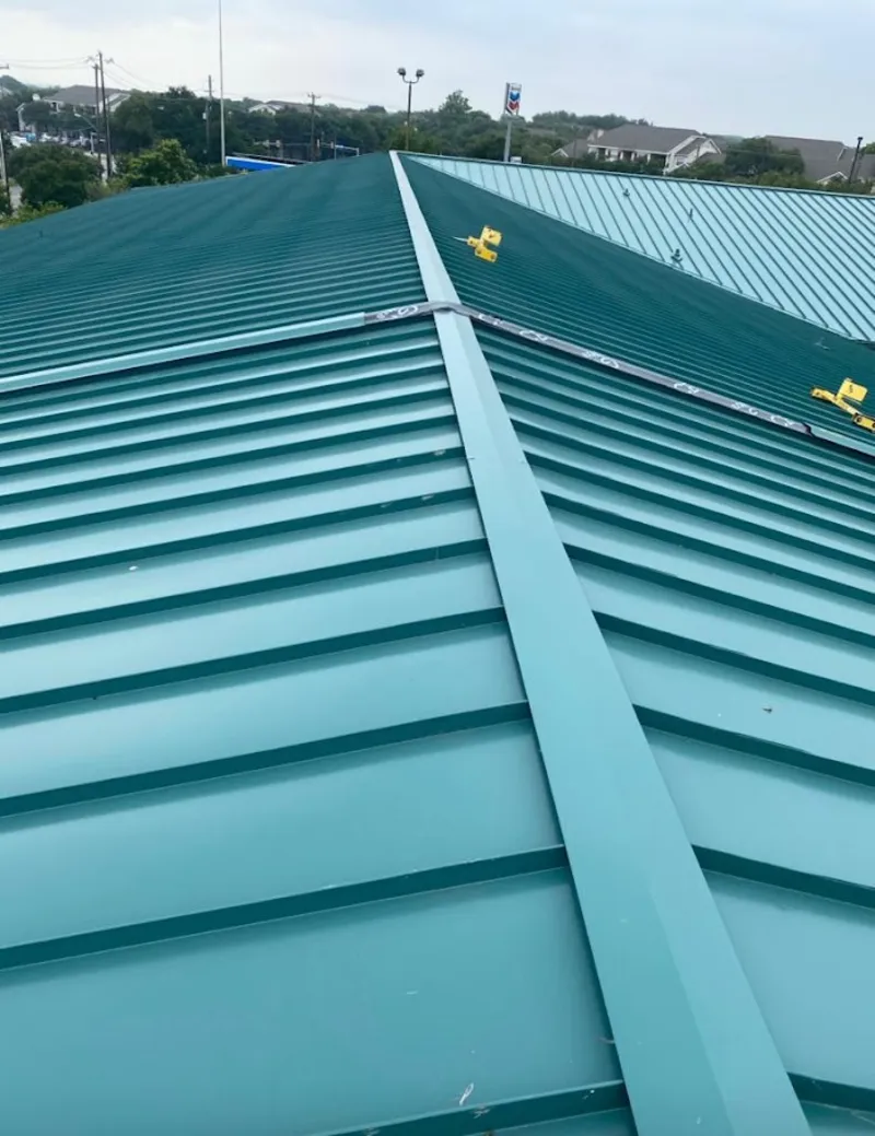 Green commercial metal roof ridge and valley for Metal Roof Repair in Chelmsford